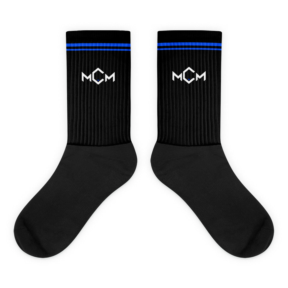 MCM Training Socks: black leg with electric blue stripes, the white MCM mark and a black foot